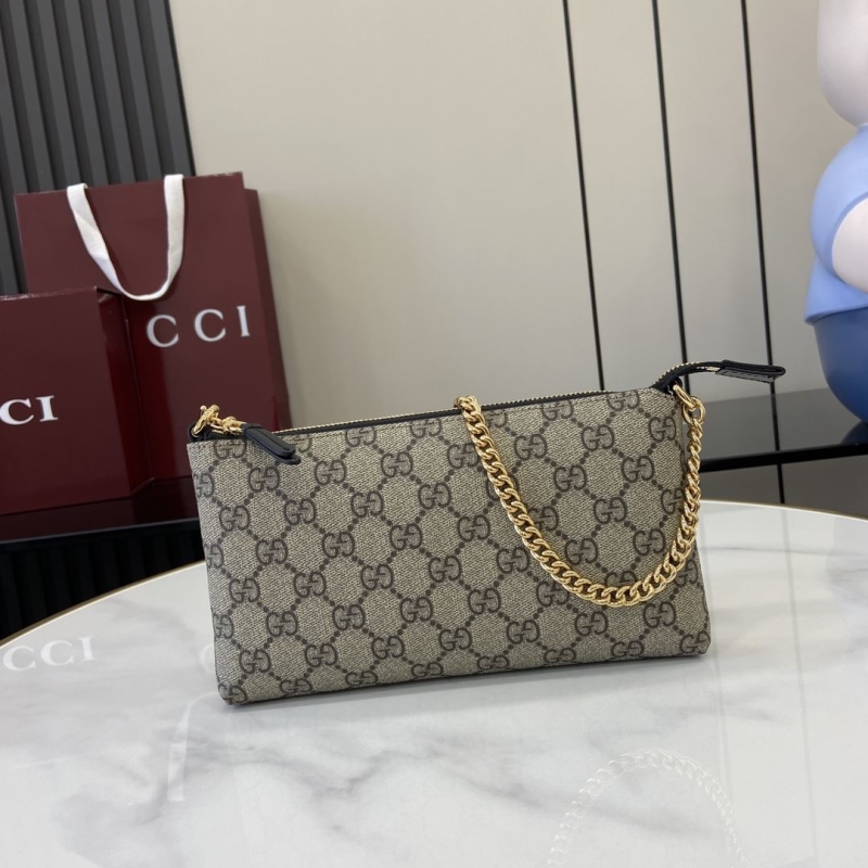 G*u*i clutch bags